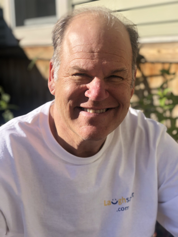 Photo of Jay Rehak smiling outside